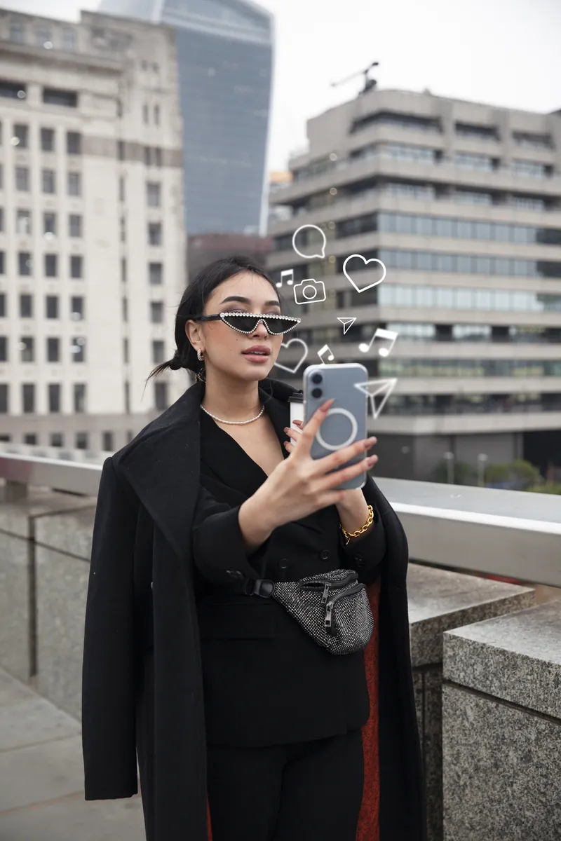 A learner using a phone outdoors